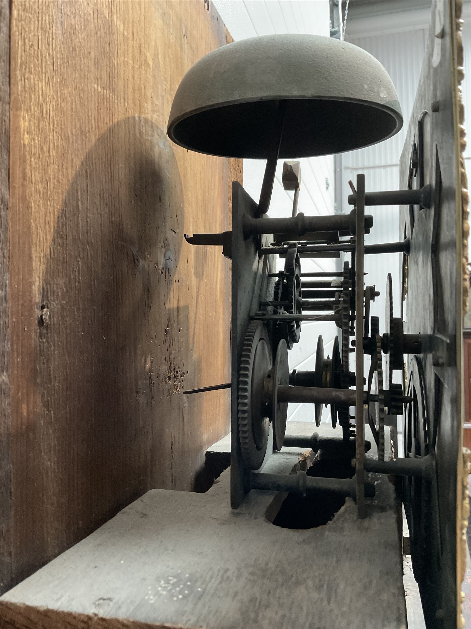 William Coulton of York - 18th century 30-hour ebonised longcase clock, with a flat pediment, broad cornice and plain frieze beneath,, square hood door with attached pillars, long break arch trunk door and rectangular plinth,  matted dial centre with curved date aperture and cast spandrels, chapter ring with Roman numerals, five minute Arabic's, minute and inner quarter hour tracks, count wheel striking movement striking the hours on a bell. With pendulum and weight.