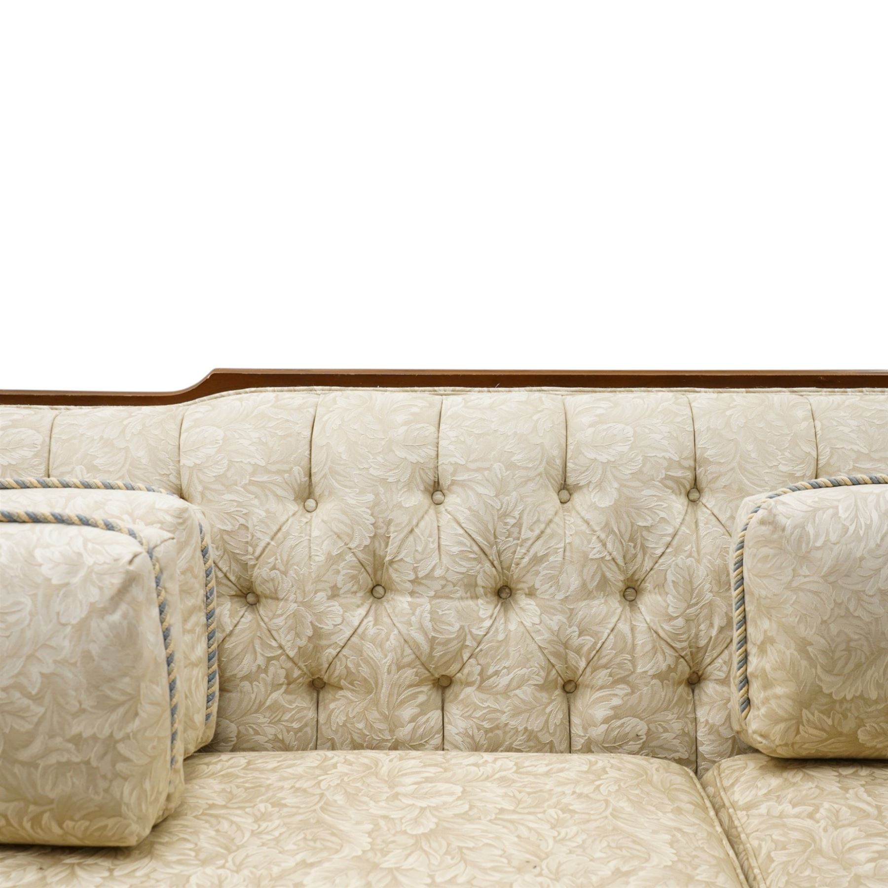 Mahogany framed three seat sofa in the Louis XV style, the shaped buttoned back above loose seat cushions and scrolling arms, raised on cabriole legs with shaped apron