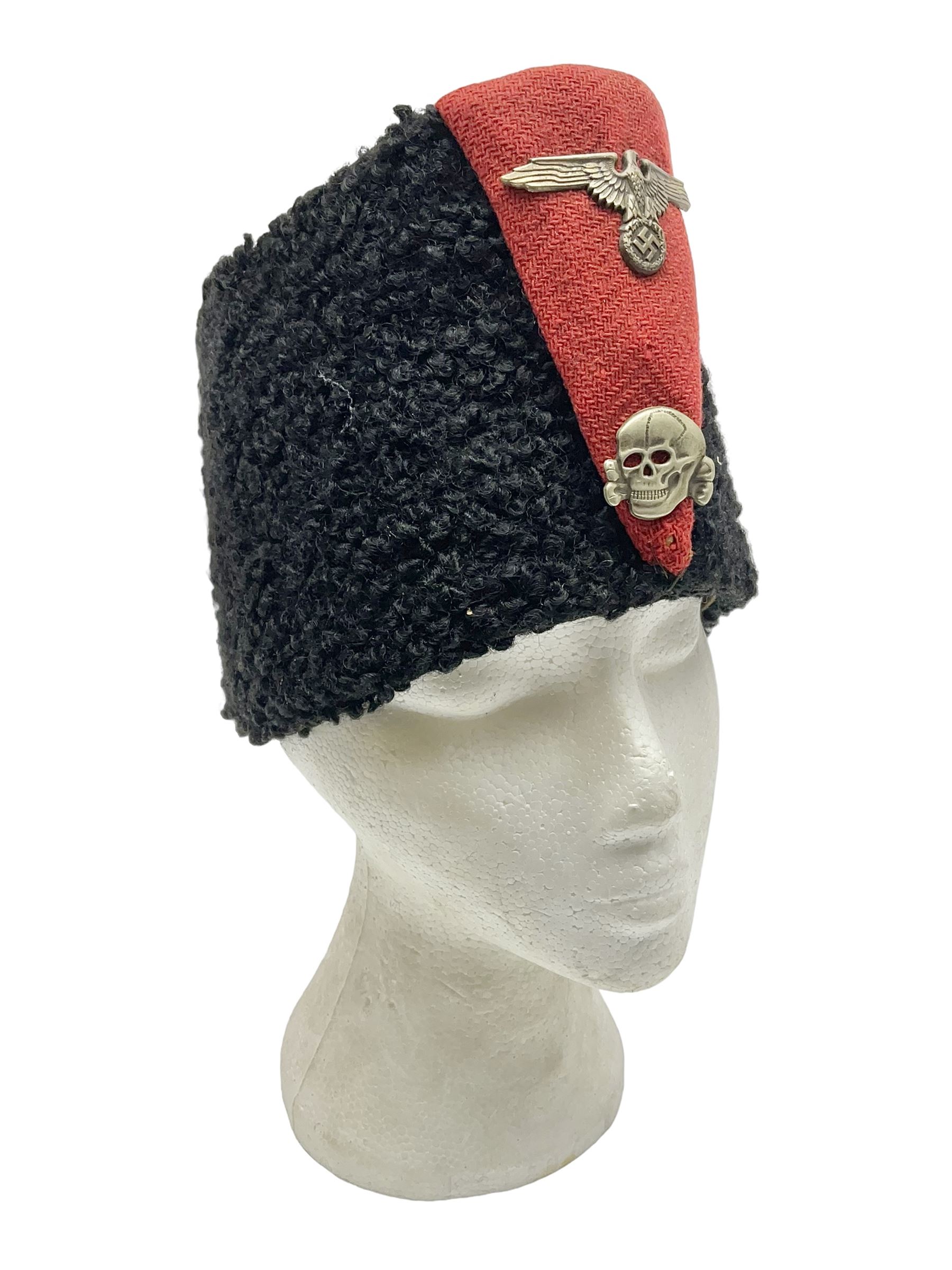 WW2 German small size Balkan style hat with 'SS' metal badges; red cloth top and flash to front with black persianelle type sides; lined in brown card with leather sweatband