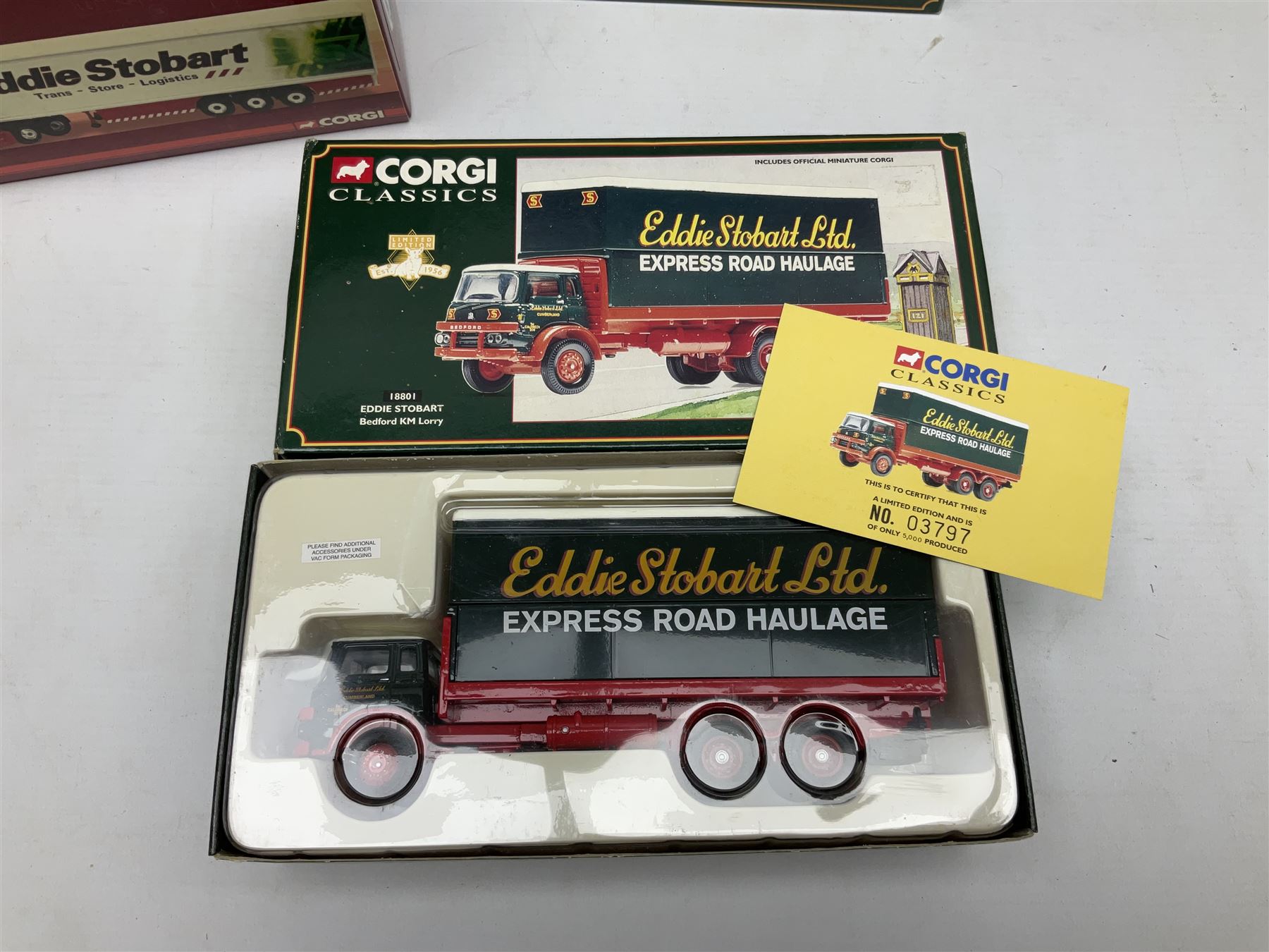 Corgi Eddie Stobart - four Classics lorries; 18801 Bedford KM, 97369 AEC Truck & Trailer, 23101 Ford Transcontinental Tilt Trailer and 14303 Foden S21 Artic Trailer; limited edition 21601 AEC Ergomatic 6-wheel Tipper; and two others in the Roadscene and Truckfest 25 Series; all boxed (7)