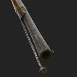 Middle Eastern percussion cap rifle, the 107cm  barrel with four brass bands and ramrod under, overall L143cm, together with another percussion rifle the 106cm barrel a copy of a 17th century Spanish barrel, complete with fake stamp, by vendors repute this rifle was confiscated from tribesmen in Kurdistan by police
Sold as an exempt item under Section 58 (2) of the 1968 Firearms Act, to be held as a curiosity or ornament