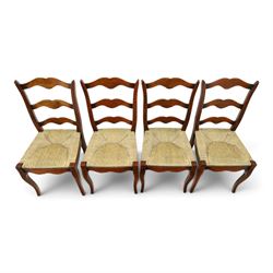 French cherry wood extending dining table, rectangular top on square chamfered supports with two additional leaves; with Batheaston - set of eight cherry wood waived ladder back dining chairs with rush seats (W46cm H98cm)