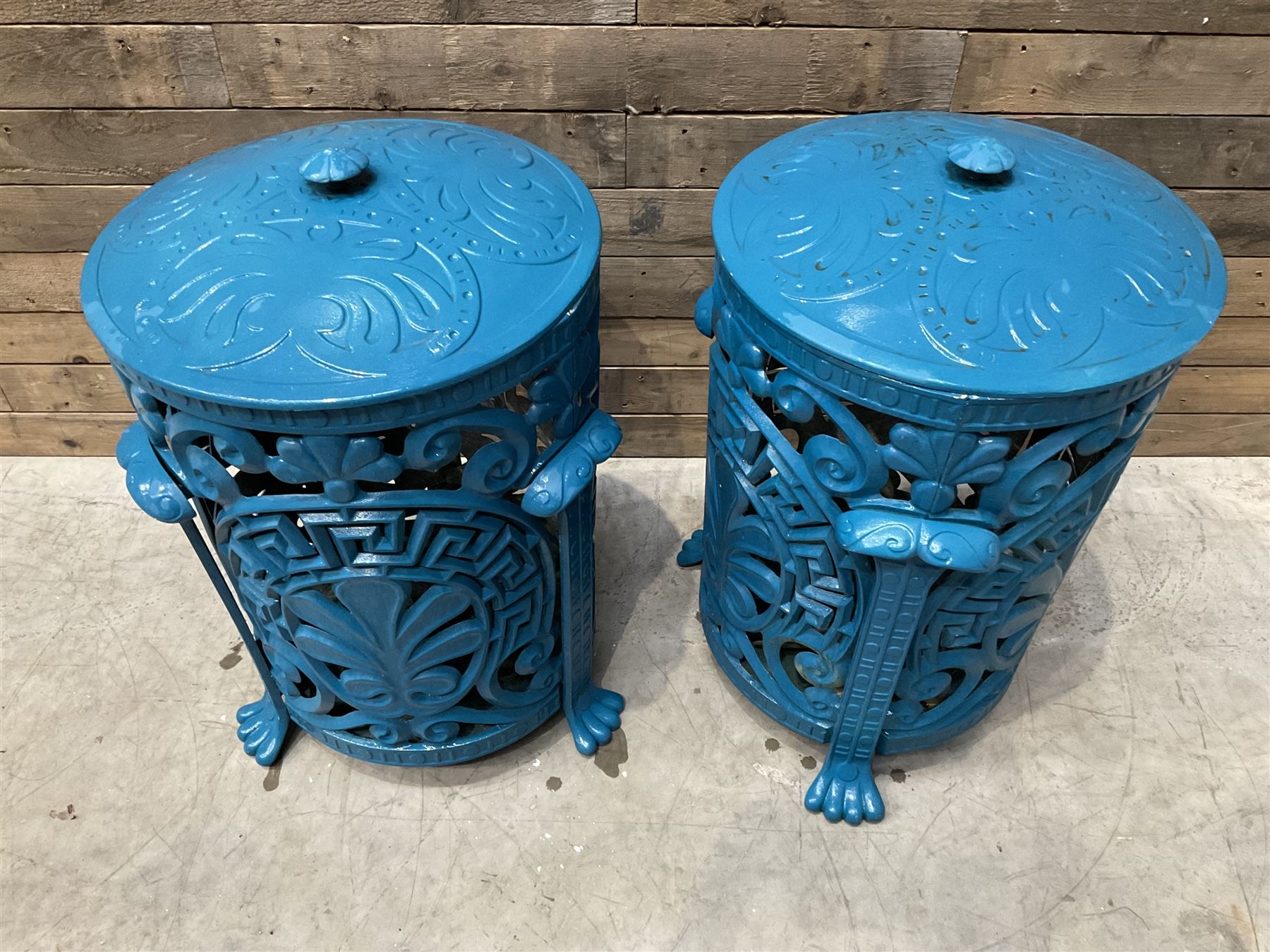 Pair of blue painted cast iron garden bins