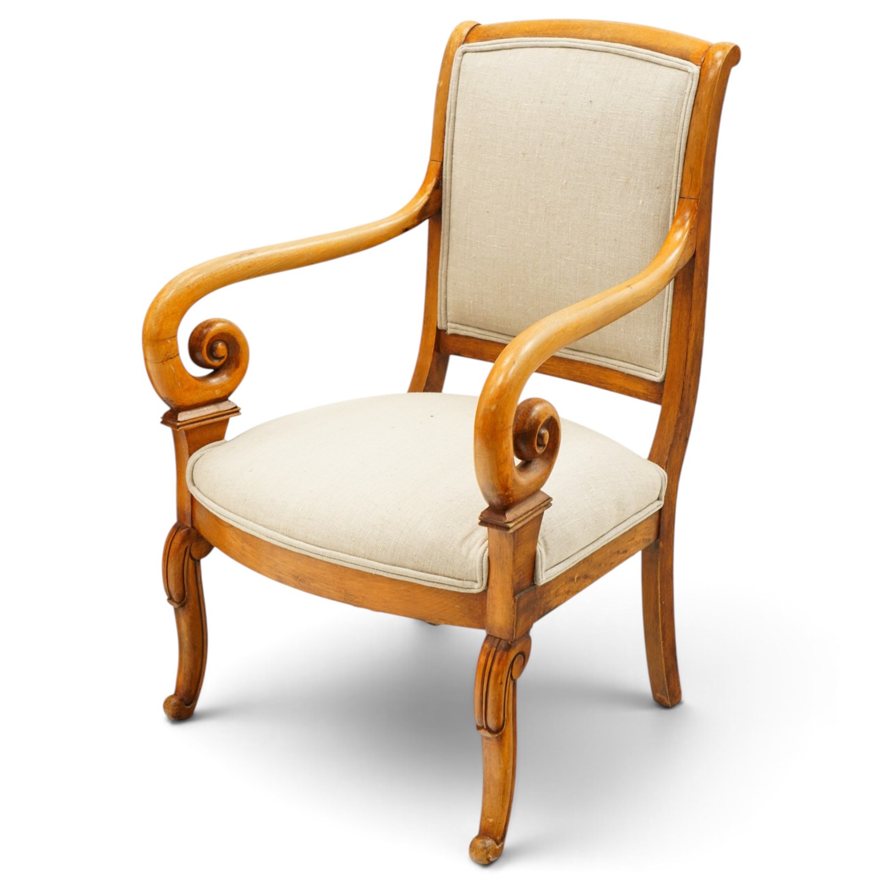 Pair of French Empire design fauteuil armchairs, high back over scrolled arm terminals, upholstered in cream fabric, on scroll carved cabriole supports