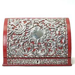 Late Victorian red leather stationery casket with divided watered silk interior, the hinged front with repousse silver mounts H19cm x W30cm London 1889 Maker William Comyns