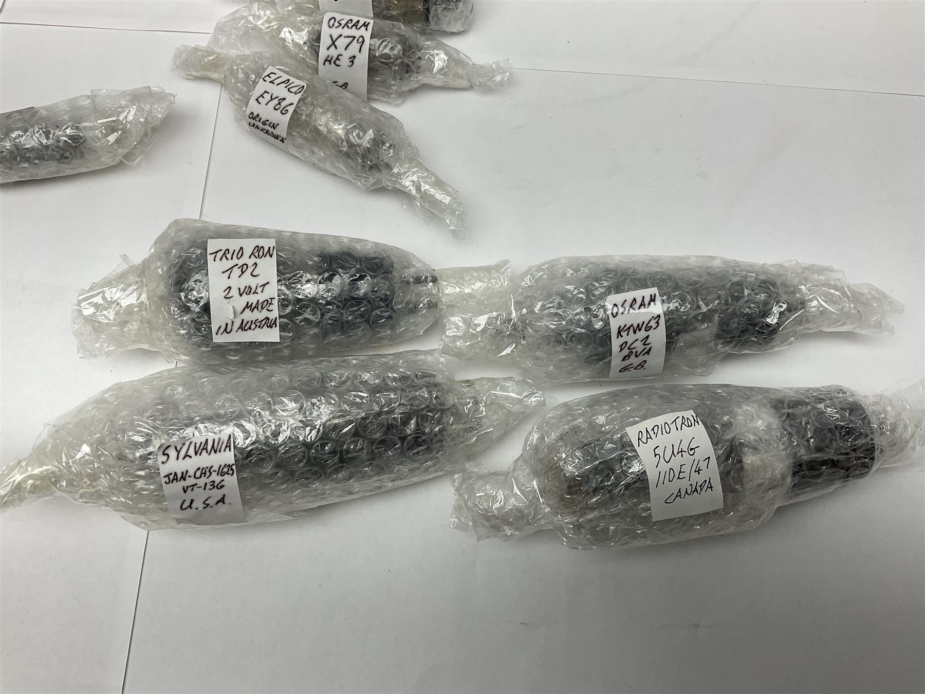 Collection of Osram, Elpico, Sylvania and similar thermionic radio valves/vacuum tubes, including P2, L21, DH77 GK9, U14 and PCLl86, approximately 19 as per list, unboxed