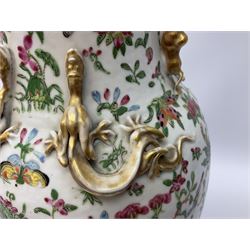 Late 19th century Chinese Rose Canton vase, with lobed rim and applied twin gilt temple lions to the waisted neck, and four gilt dragons to shoulders, hand painted with exotic birds, butterflies and blossoming flowers, H43.5cm