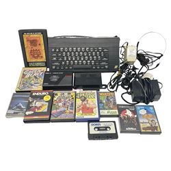 Sinclair ZX Spectrum (1984) with accessories and games; ten games for Sinclair Spectrum and 48K Spectrum to include ‘Knight Lore’, ‘The Way of the Exploding Fist’, and ‘Green Beret’ all in original boxes, ‘Rambo First Blood Part II’ without original box; Sinclair UK1400 Power Supply Unit, Hales Universal Mains Adapter, RAM Turbo Spectrum Joystick Interface, Starlite Cassette Player, all without boxes