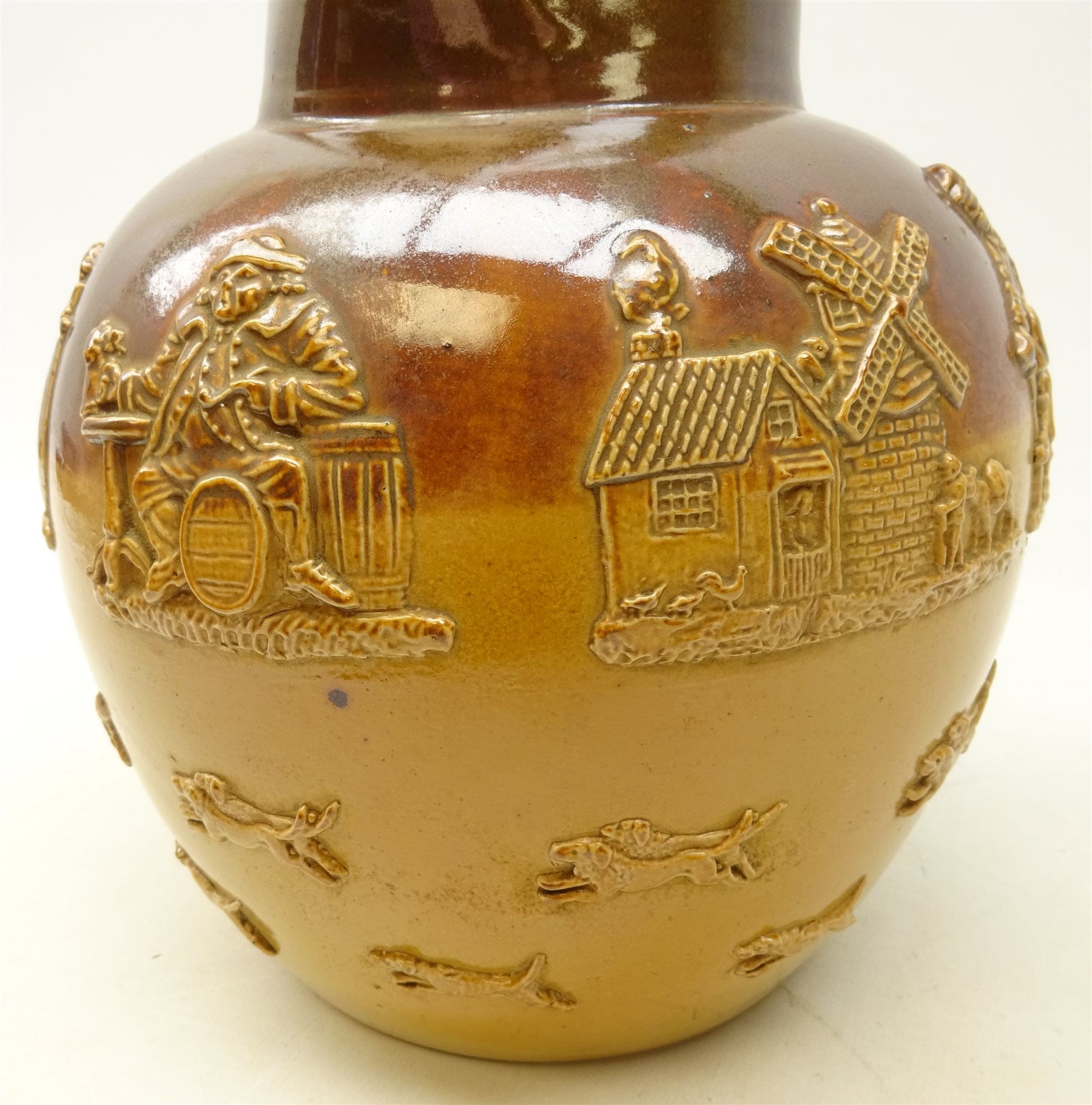 Large Doulton Lambeth stoneware harvest jug of bulbous form applied