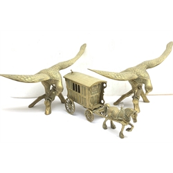 A pair of large brass eagles, L67cm H44cm, together with a large brass model of a horse drawing a wagon, L54cm. 
