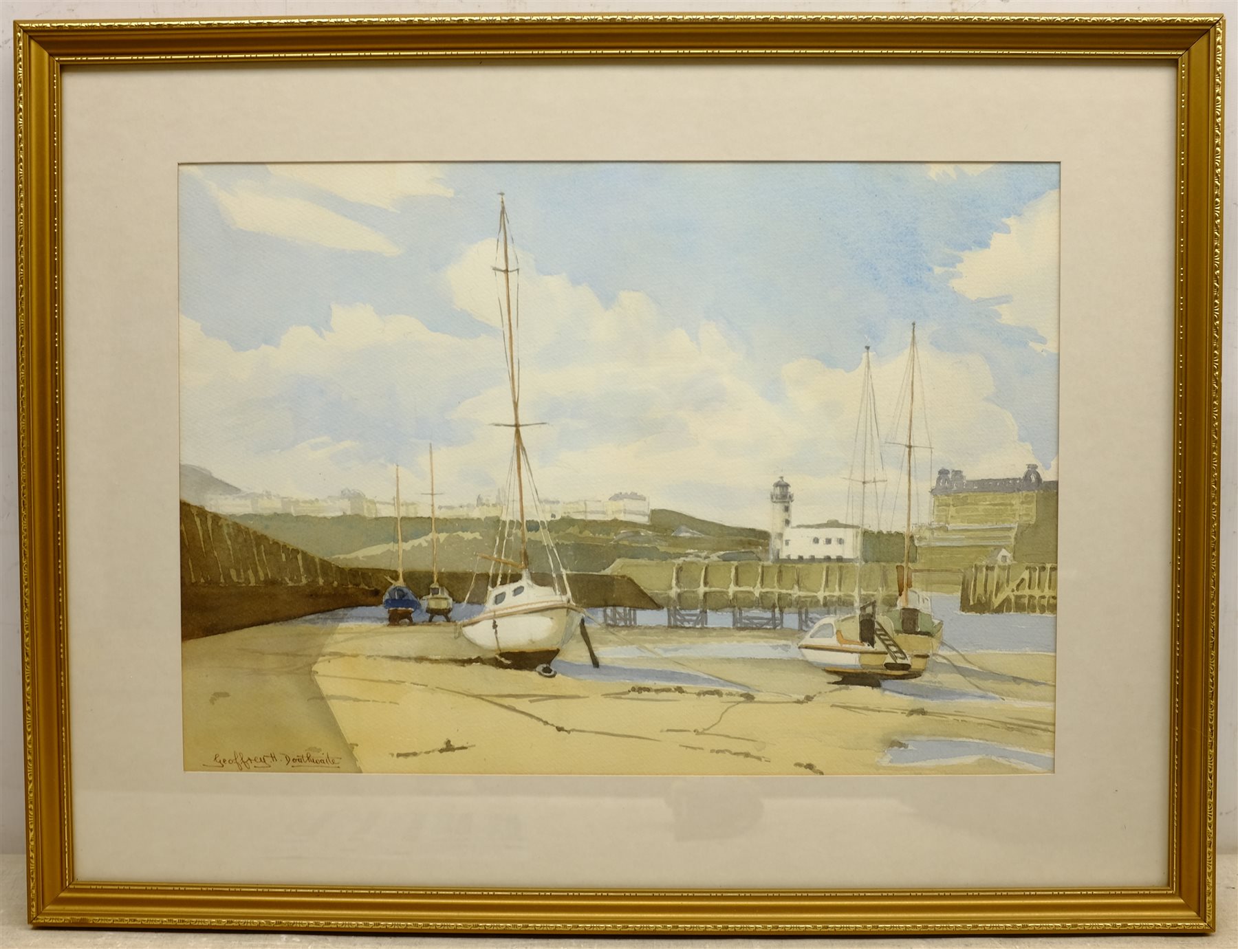  Thomas Hart (British 1830-1916): 'Castle Rock, Lynton', watercolour signed, titled on the mount, Geoffrey H Douthwaite (British 20th century): Scarborough Harbour, watercolour signed, and a drypoint etching of Chester indiscinctly signed in pencil, max 33cm x 47cm (3)  