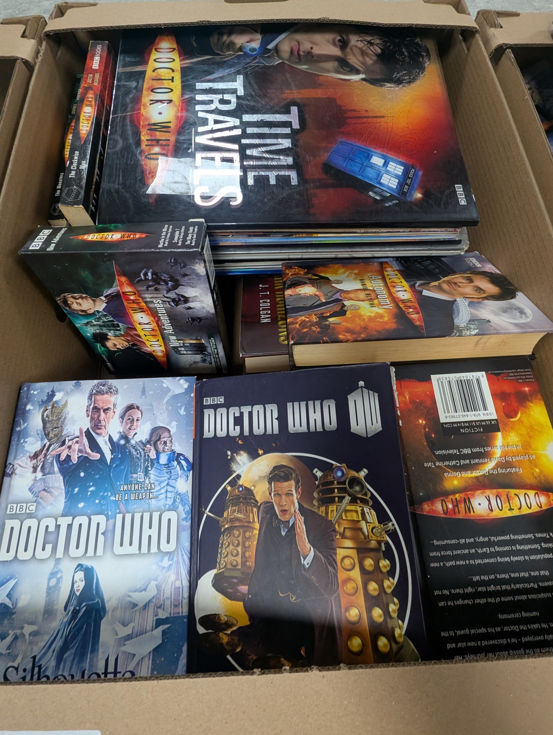 Large collection of Sci-Fi books and ephemera, including Star Wars, Star Trek and Doctor Who novels, in four boxes