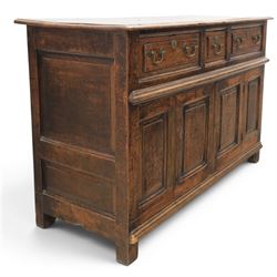 George III oak dresser base, rectangular top with moulded edge, three fielded panelled drawers with brass swan neck handles, over four fielded panelled front with the central two cupboard doors, raised on stile supports