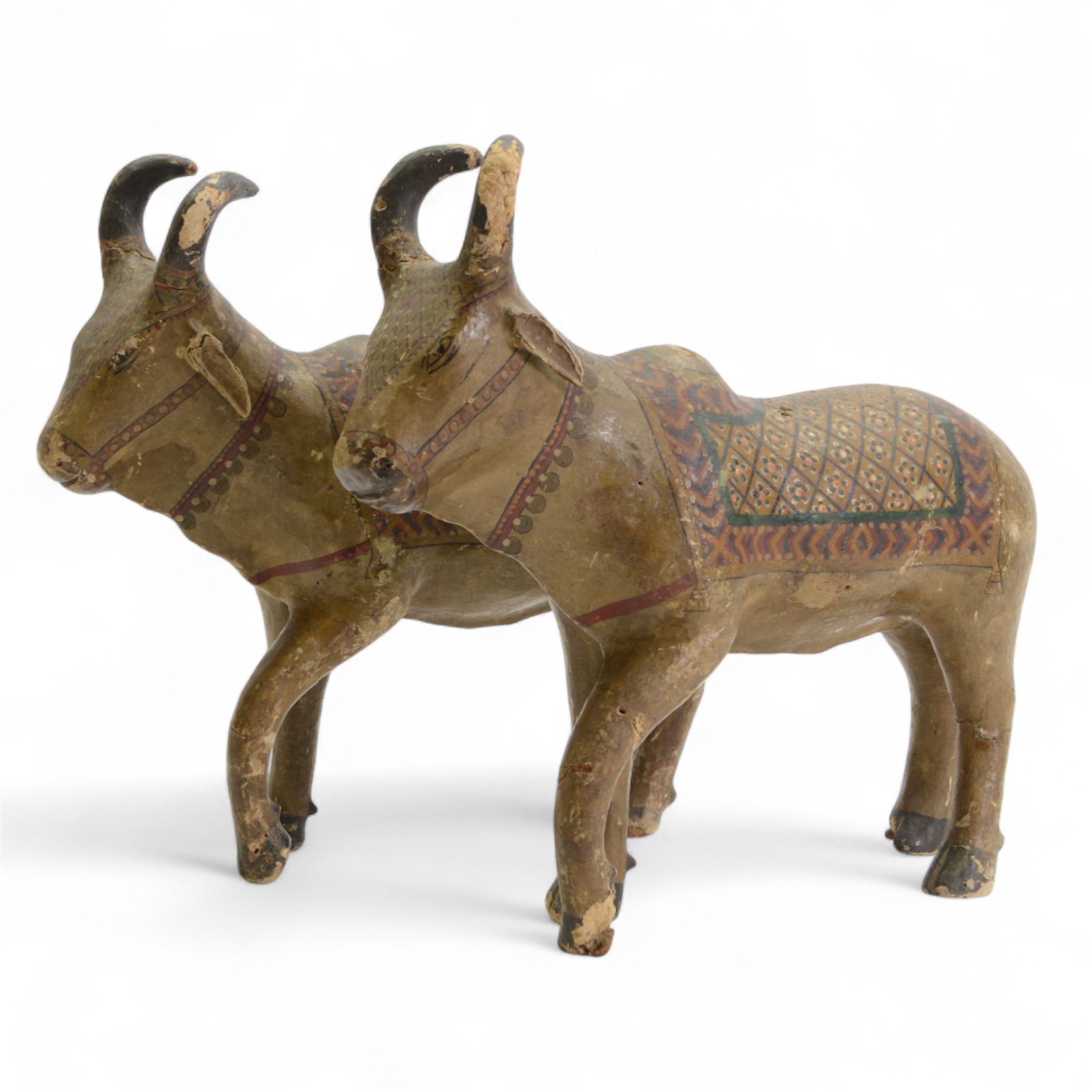 Pair of 19th century Indian hand painted Nandi bulls, H35cm