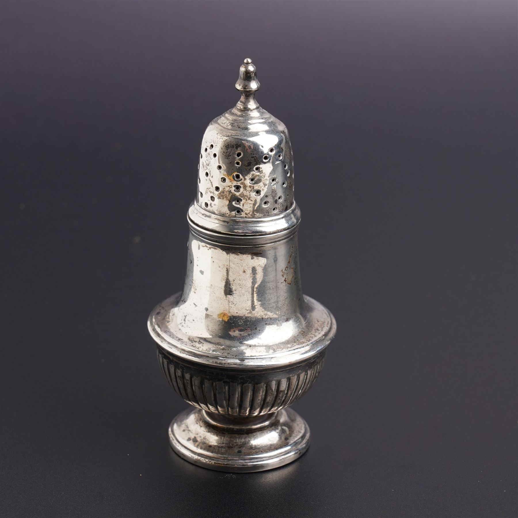Silver urn shape sugar caster on pedestal foot Birmingham 1923, engraved silver vesta case and asilver pepperette