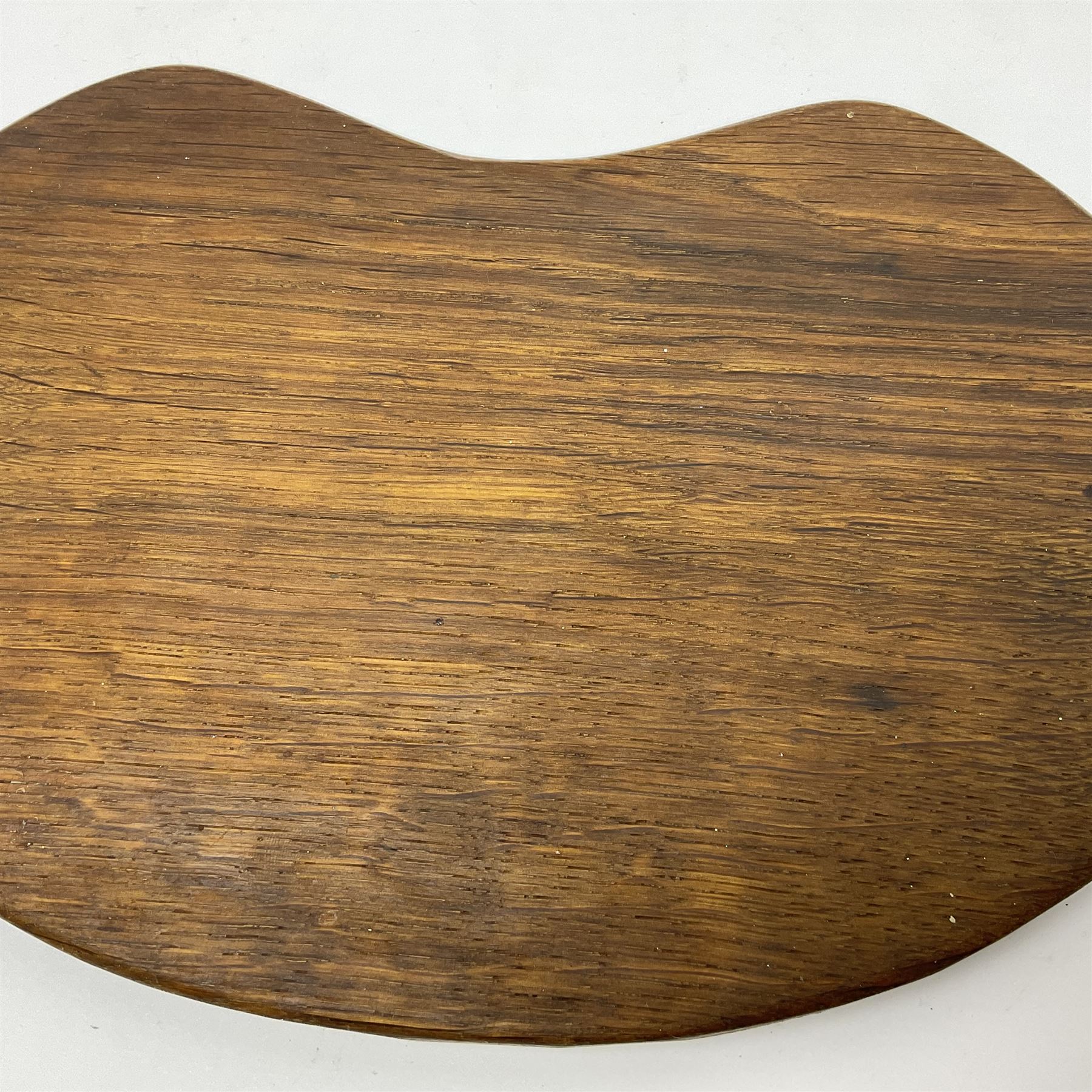 Mouseman - oak kidney-shaped cheeseboard, the handle caved with mouse signature, by the workshop of Robert Thompson, Kilburn 