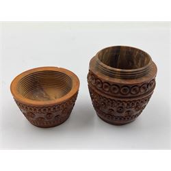 Three 19th century coquilla nut pomanders or flea catchers, two of egg shaped form and the third of barrel from with carved and pierced decoration and screw threaded join, largest H8cm