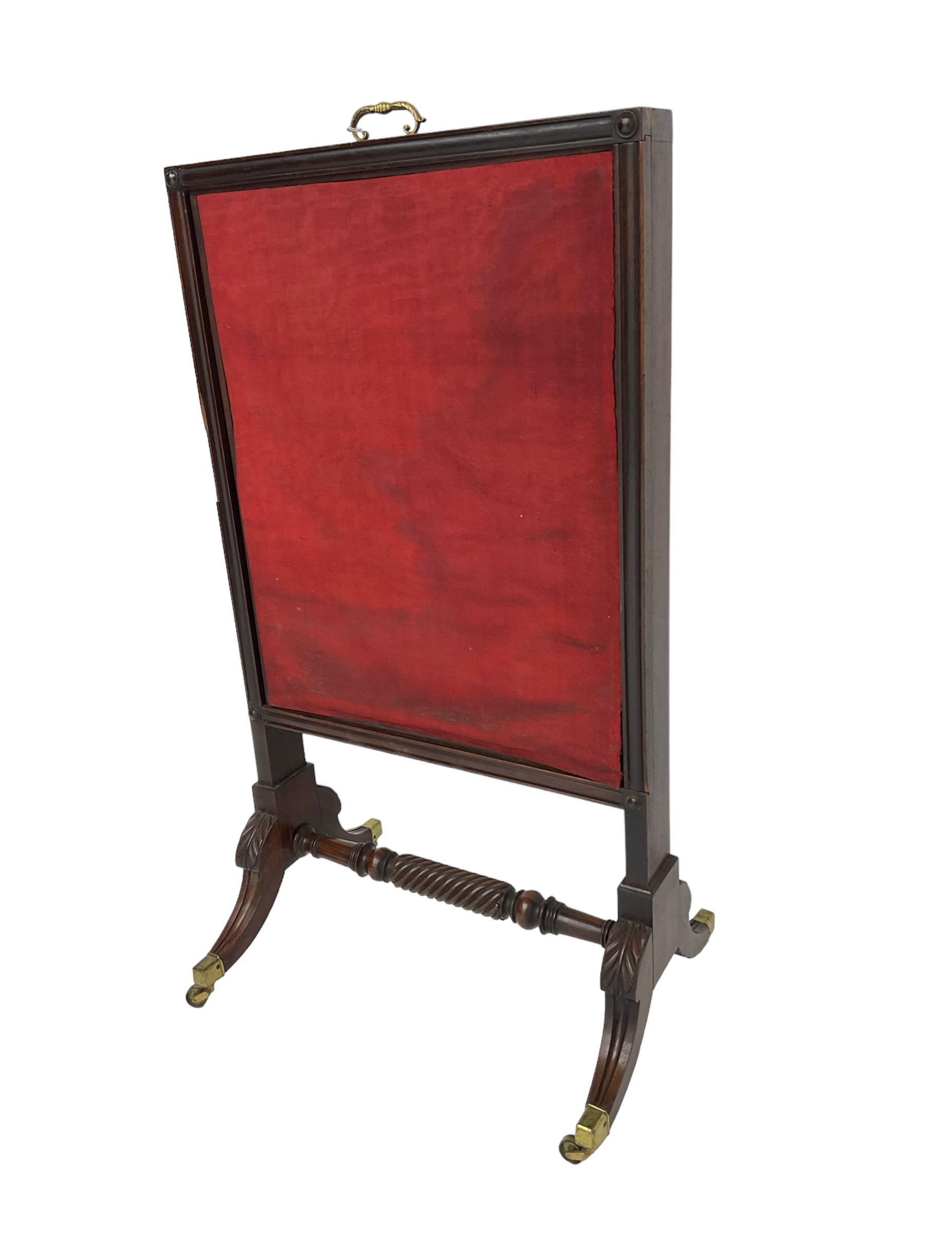 Regency mahogany screen with two horizontal and one vertical pull-out panels, on base with carved sabre legs and rope-twist stretcher