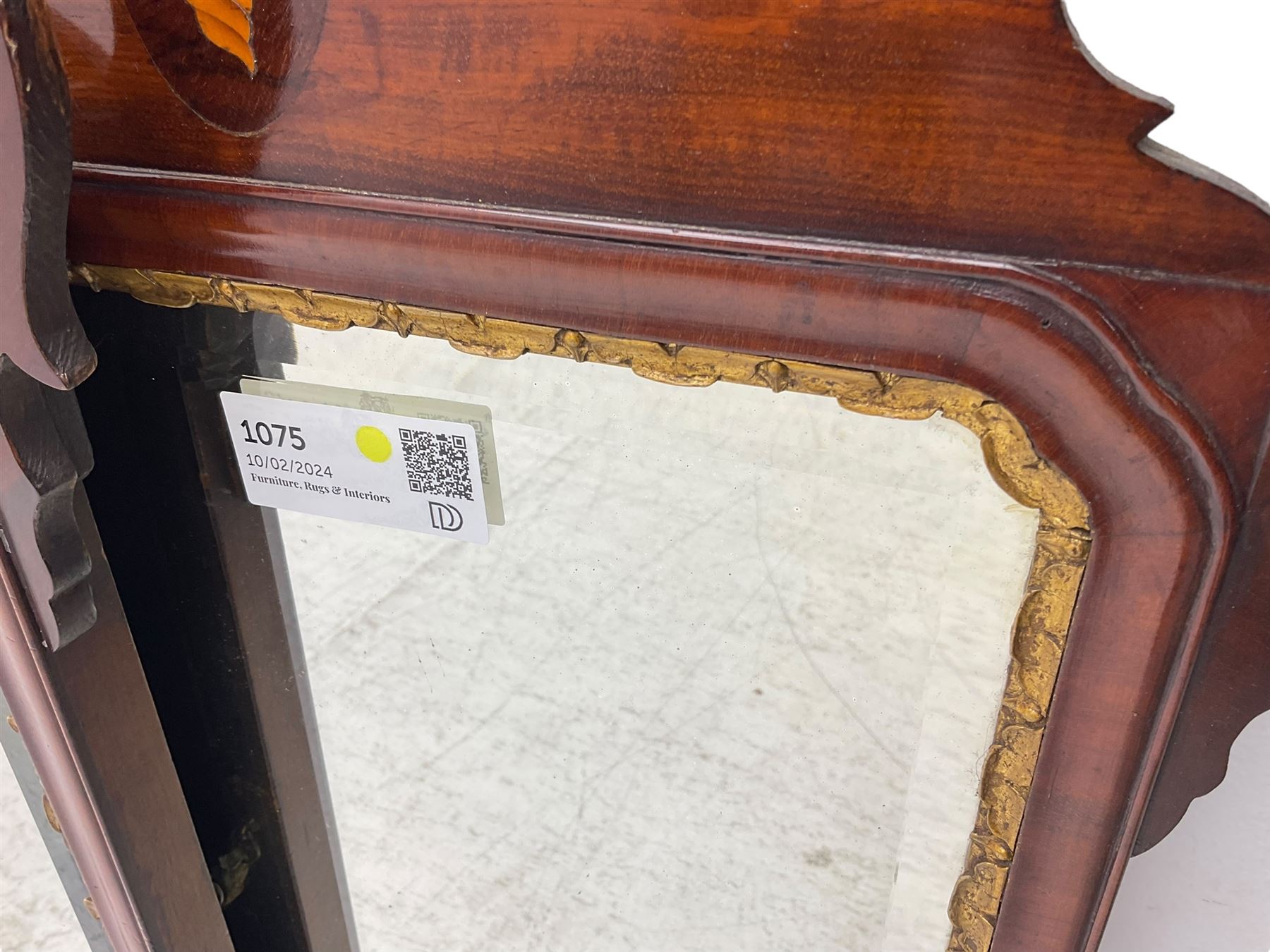 Pair of early 20th century Georgian Chippendale mahogany design wall mirrors, shaped pediment and terminal with shell motif inlays, rectangular bevelled plate within a foliate carved gilt slip