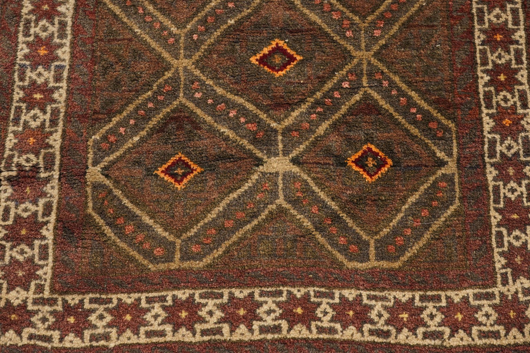 Two hand-knotted rugs, comprising Persian medallion rug and tribal rug, Persian hand-knotted rug, ivory ground centred by shaped floral medallion with pendants, surrounded by stylised flowerheads and foliate motifs, enclosed by multiple floral and geometric borders, H155cm, W123cm; tribal hand-knotted rug, dark brown ground with repeating linked geometric diamond medallions in orange and green, enclosed by ivory geometric border, striped ends with fringes, H150cm, W71cm