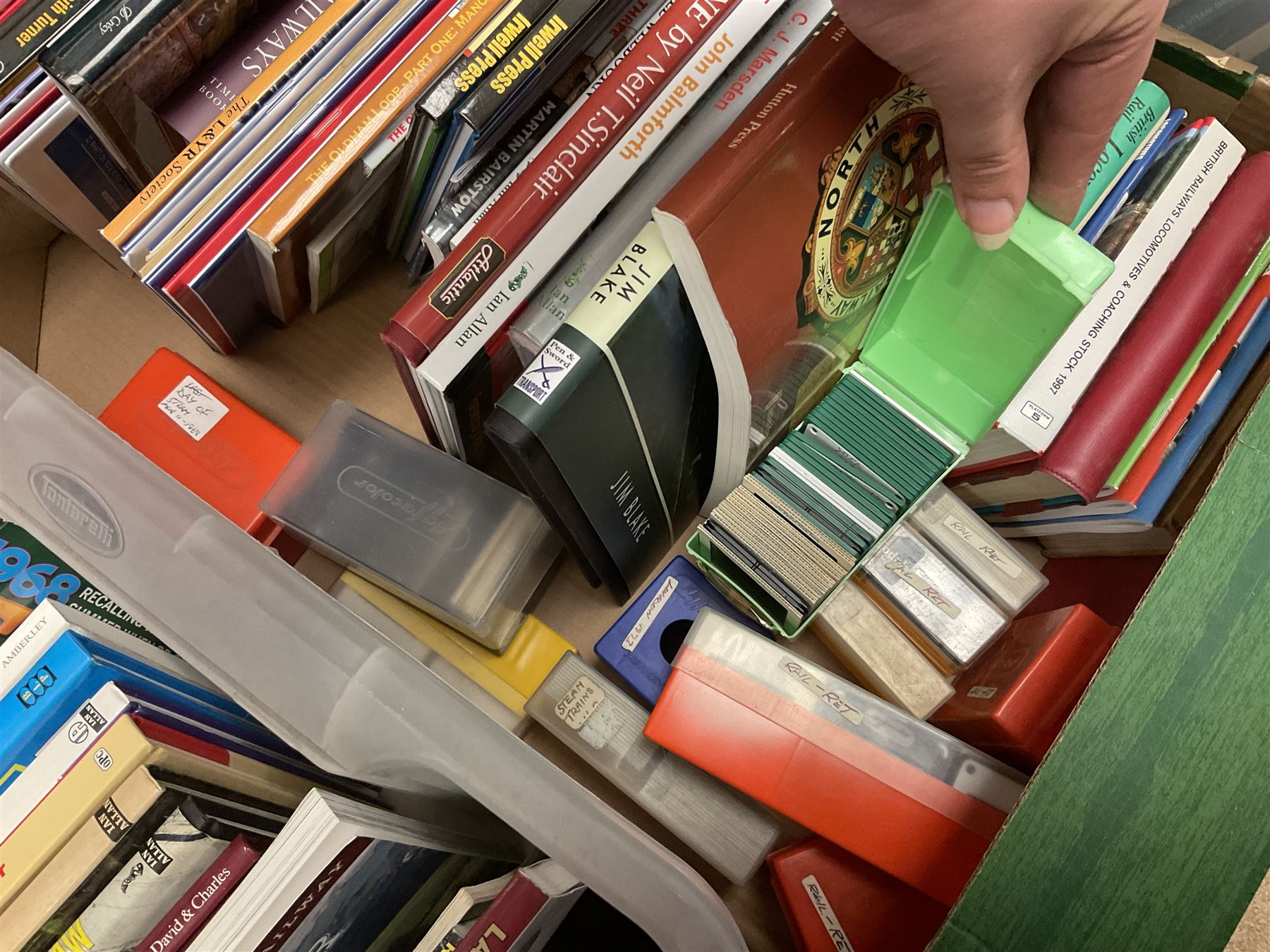 Collection of various train related books, ephemera and paraphernalia, to include various photographs, slides, the Lancaster & Yorkshire Railway Magazine, Rail Guides etc, in four boxes 