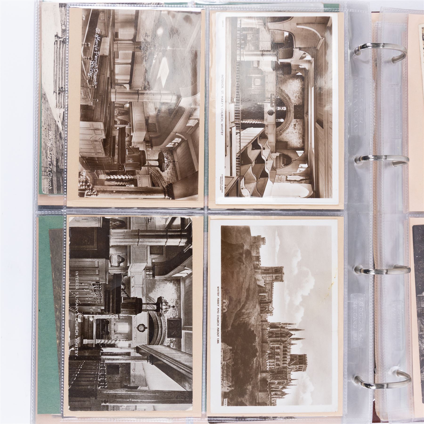 Two-hundred and thirty eight early 19th century to 20th century Whitby view postcards, including twenty-four early 19th century court cards, seventeen views of Whitby Abbey, forty depicting the fishing fleet and harbour, with a selection of cards providing a detailed study of the early 'Yards' the fisherman's dwellings around the harbour, all housed within a Stanley Gibbons Picture Postcard Album