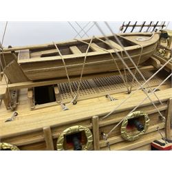 Wooden kit built model of HMS Neptune, 1:90 scale, with detailed rigging to three masts and a row of cannons to either side, upon ebonised wooden base, including stand H71cm