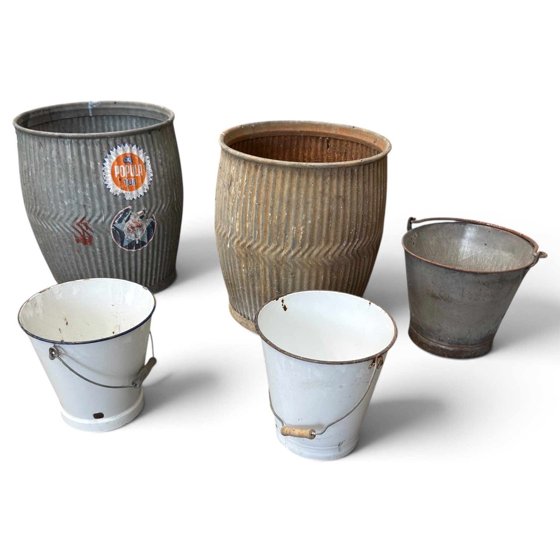 Collection of three ribbed galvanised dolly tubs with chevron detail, one retaining ‘The Popular Tub’ label, together with two white enamel buckets and a galvanised bucket, each with swing handle, max W46cm H53cm