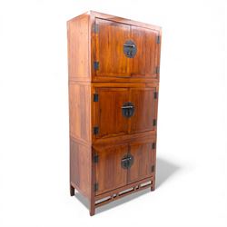 20th century Thai elm compound cabinet, formed of three stacking chests each enclosed by d...