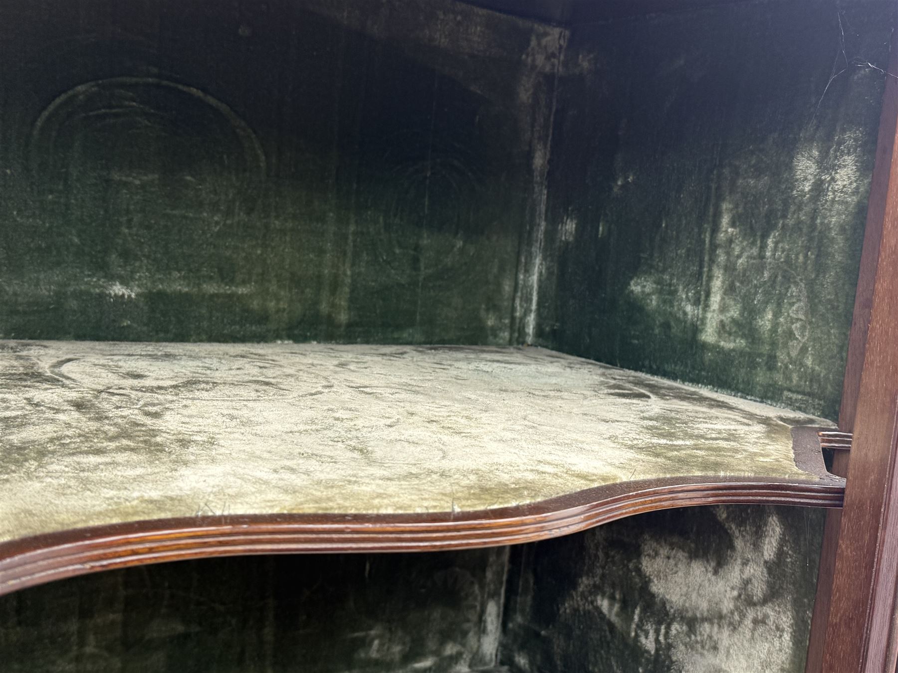 Victorian hardwood and inlaid display cabinet, central breakfront glazed display with astragal glazing and mirror back, flanked by mirrored alcoves with turned supports, below foliate and scrolling marquetry panels enclosing cupboard doors, shaped open shelves with turned supports beneath, on tapered and spade feet