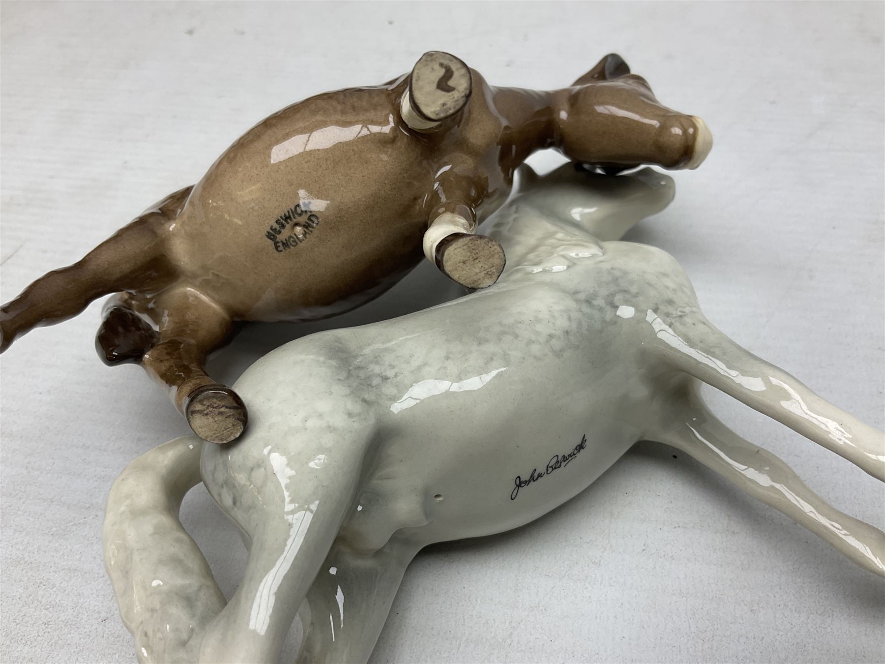 Collection of Beswick horse figures, to include Red Rum on a wooden plinth,  Lammtarra on oval plinth, Morgan Horse Black and three others, together with Royal Daulton Appaloosa Foal and a USSR horse