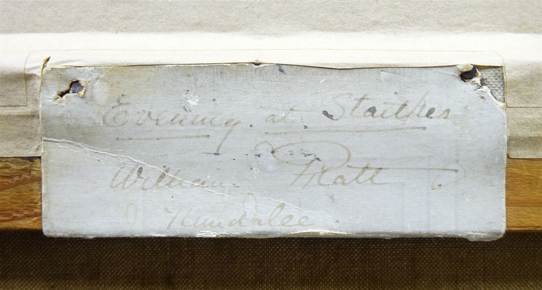 William Pratt (Scottish 1855-1936): 'Evening at Staithes' - the High Street, oil on canvas signed and dated 1909, titled on original label verso 45cm x 60cm 
Notes: Pratt seemingly visited Staithes multiple times in the early 1900s, as the companion to this picture, 'In the Shallows' (sold by Lyon & Turnbull 27/01/16, lot 536), in an identical frame and also depicting Staithes, is dated 1910. The shop in the foreground was a grocery run by Joseph Verrill, described in 1911 as 'grocer and agent for W & A Gilbey Ltd, Wine and Spirit Merchants'. He was often assisted by his two daughters, Lavinia and Hannah. The Verrills were one of the largest families in Staithes; Joseph Verrill Snr (1839-1910) was first coxswain of the Staithes lifeboat, and Isaac Verrill (1811-1895), a fisherman, was photographed by Frank Meadow Sutcliffe (1853-1941). The building became the gift shop of W & H Dean in the 1950s, and is now the Endeavour Café.