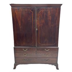 George III mahogany linen press, moulded projecting cornice over two figured doors, the interior fitted with four linen slides, the lower section fitted with two short and two long drawers, on splayed bracket feet 
