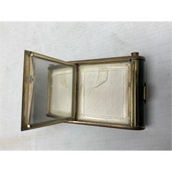 Art Deco camera shaped lady's musical compact and cigarette case, probably German, with green marble effect panels and gilt highlights, with large hinged opening to reveal engine turned brass interior with cigarette or lipstick holders, and the other side with musical mechanism and flip action powder compartment with mirror, L10cm