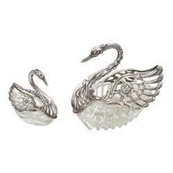 Silver mounted cut glass swan dish, with pierced and embossed hinged wings and a smaller silver swan salt, both by E Ltd,  London import marks 1973/75