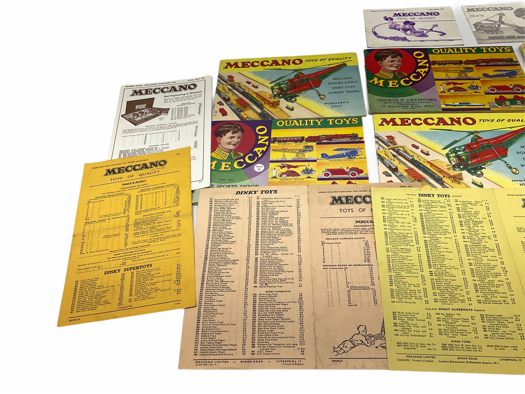 Meccano - toy shop point-of-sale cardboard advertising sign with easel back, depicting a boy finishing a large Eiffel Tower H37cm; nine catalogues 1938/9, 1939/40, 1952, 1953, three x 1956, 1958 and HRCA 1994 copy of 1939/40, bearing various toy shop addresses to front covers, some with price lists; and seven price lists 1949 - 1966.