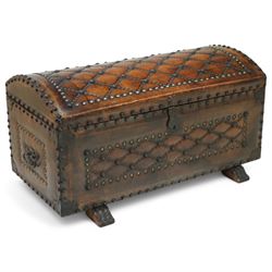 Studded leather dome top trunk, the hinged lid and front decorated with cross pattern in s...