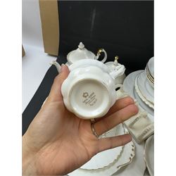 Royal Albert Val D'or part tea and dinner service, including two coffee pots, two teapots, milk jug, covered sucrier etc together with matching items 