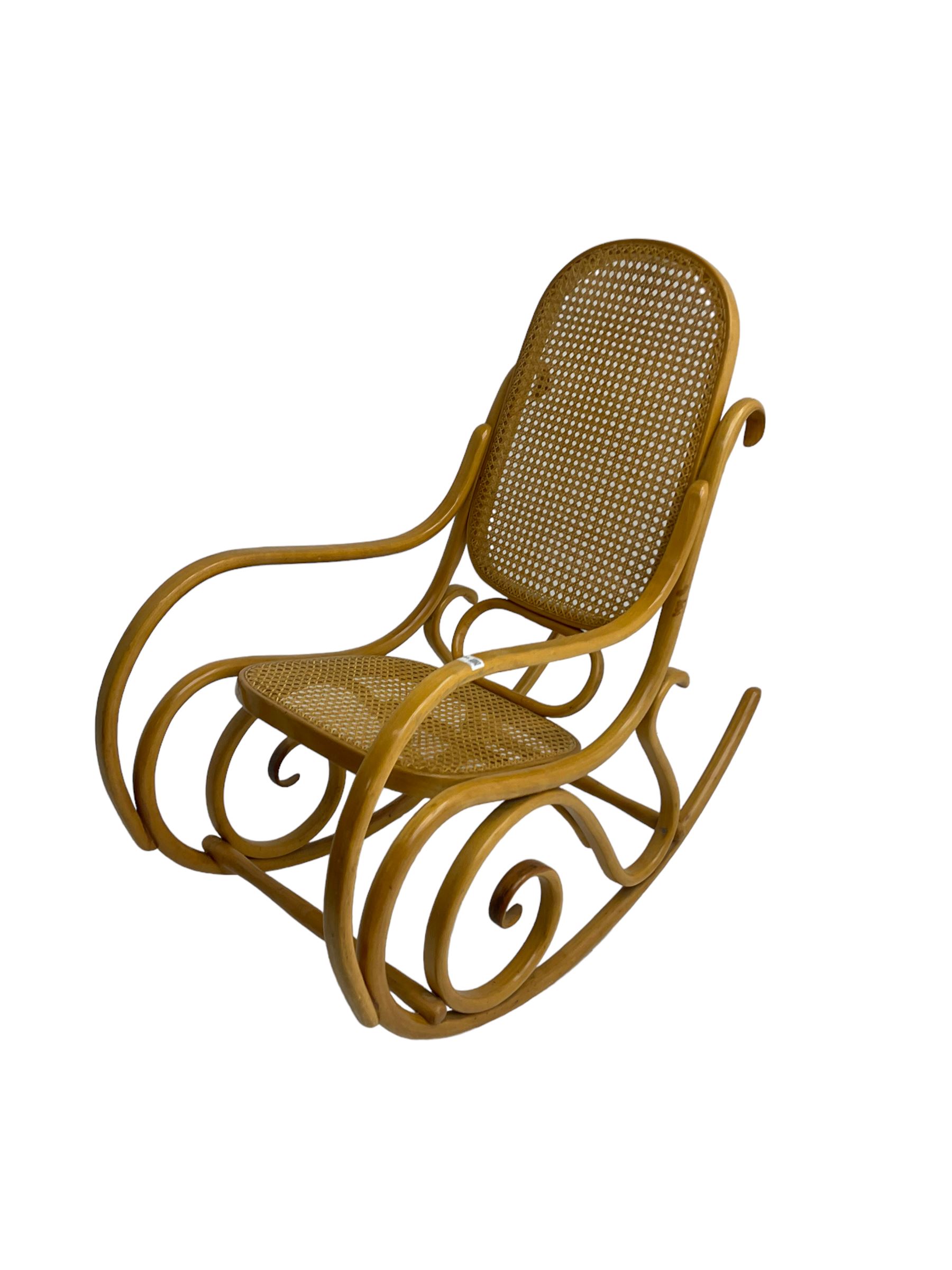 Early to mid-20th century Michael Thonet design bentwood rocking chair, with cane seat and back