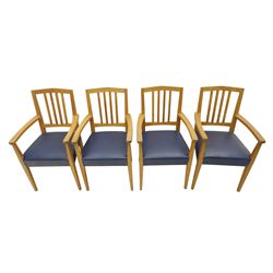 Modern twelve oak dining chairs including one 'Chairmans' chair, solid oak construction, slatted back and arm rests, blue leatherette padded seat, on tapered square supports 