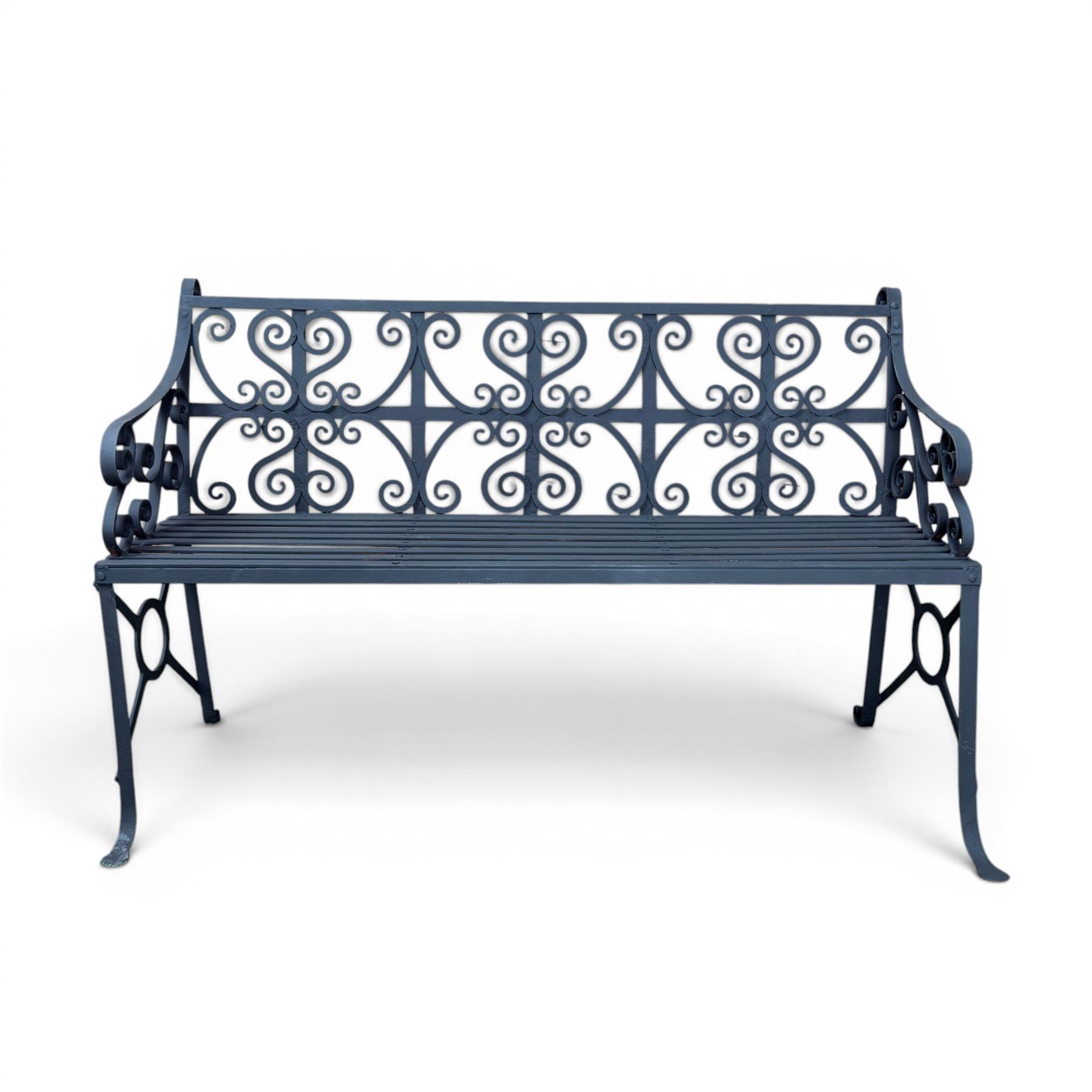 Regency period wrought iron garden bench, hand forged in wrought iron and finished in matt black paint, decorated with intricate scrollwork and featuring circular geometric ends, strapwork seat