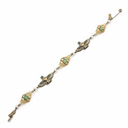 Early 20th century French 18ct gold Egyptian Revival bracelet, three winged sphinx motif panels, each set with a square cut emerald and four rose cut diamonds, spaced by six white / cream pearls and three scrolling openwork links, each centred with a square cut emerald, French assay marks
