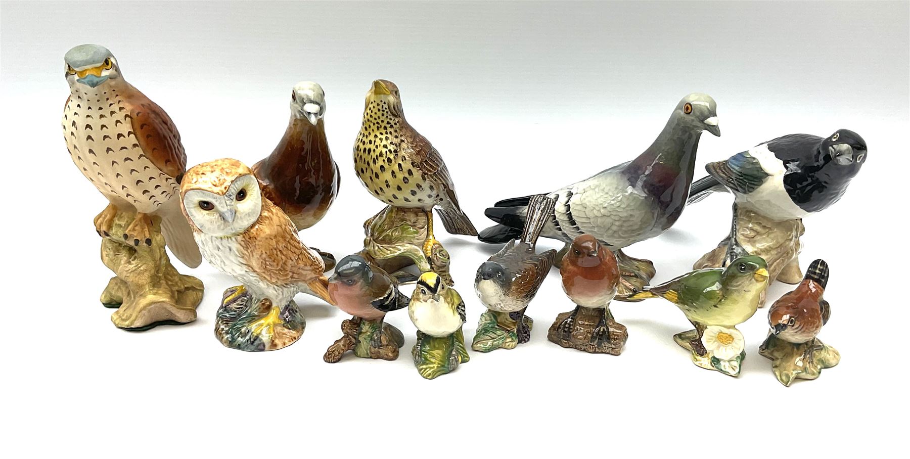 Collection of Beswick figures, to include wren model no 993, Greenfinch model no 2105, Robin model no 980, whitethroat model no 2106, stonechat model no 2274, chaffinch no 991, magpie model no 2305, etc.