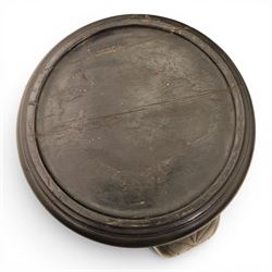 Oriental design black lacquered jardinière stand, circular moulded top with raised rim, the base formed as three elephant heads with carved ears and simulated tusks, on shaped supports with paw terminals