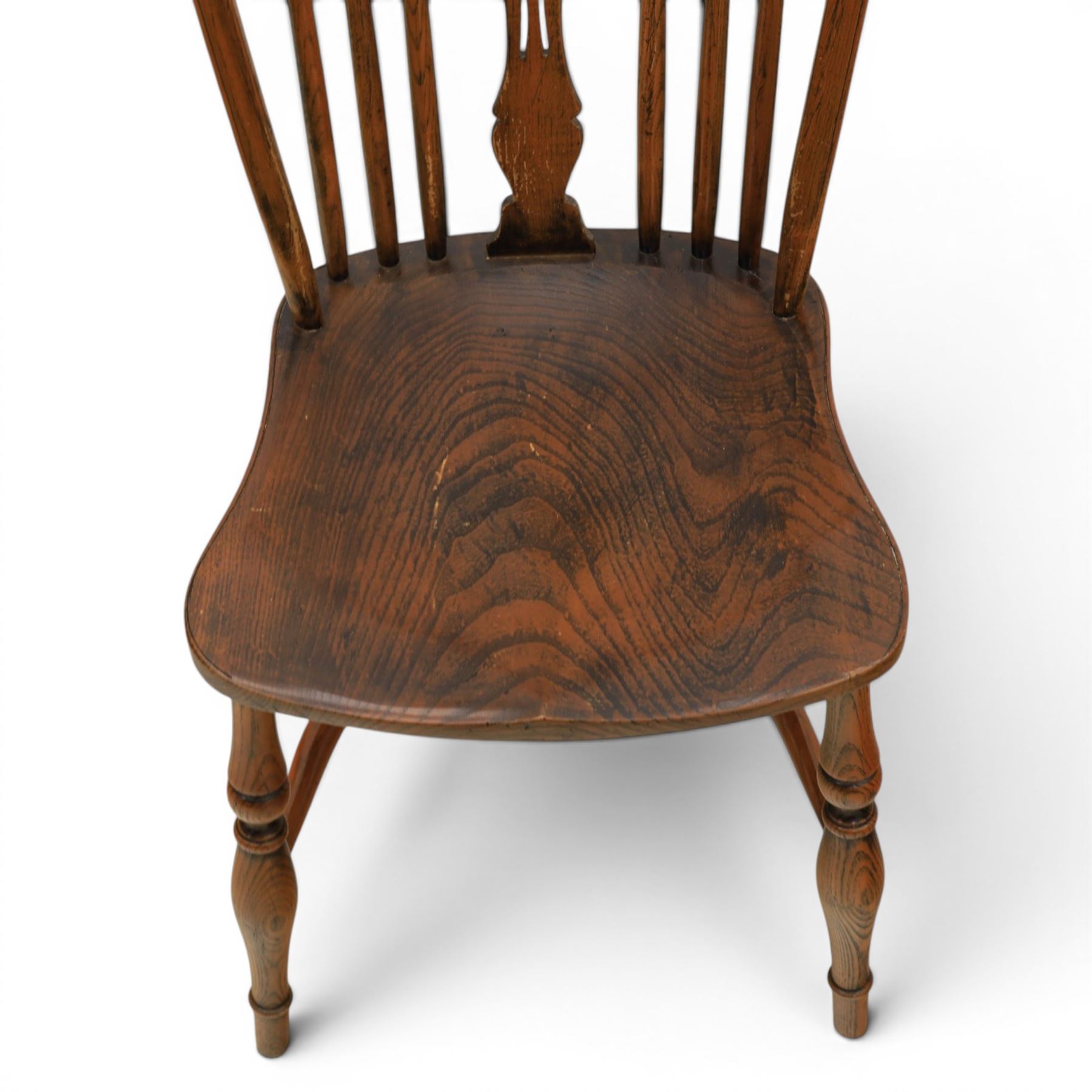 Set of six elm Windsor chairs, saddle seats with crinoline stretchers
