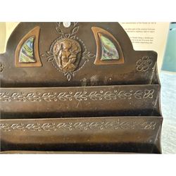 Arts and Crafts bronze letter rack, with three divisions, abalone cartouche to the front, the arch pediment with central figure flanked by abalone and impressed floral decoration, H19cm  