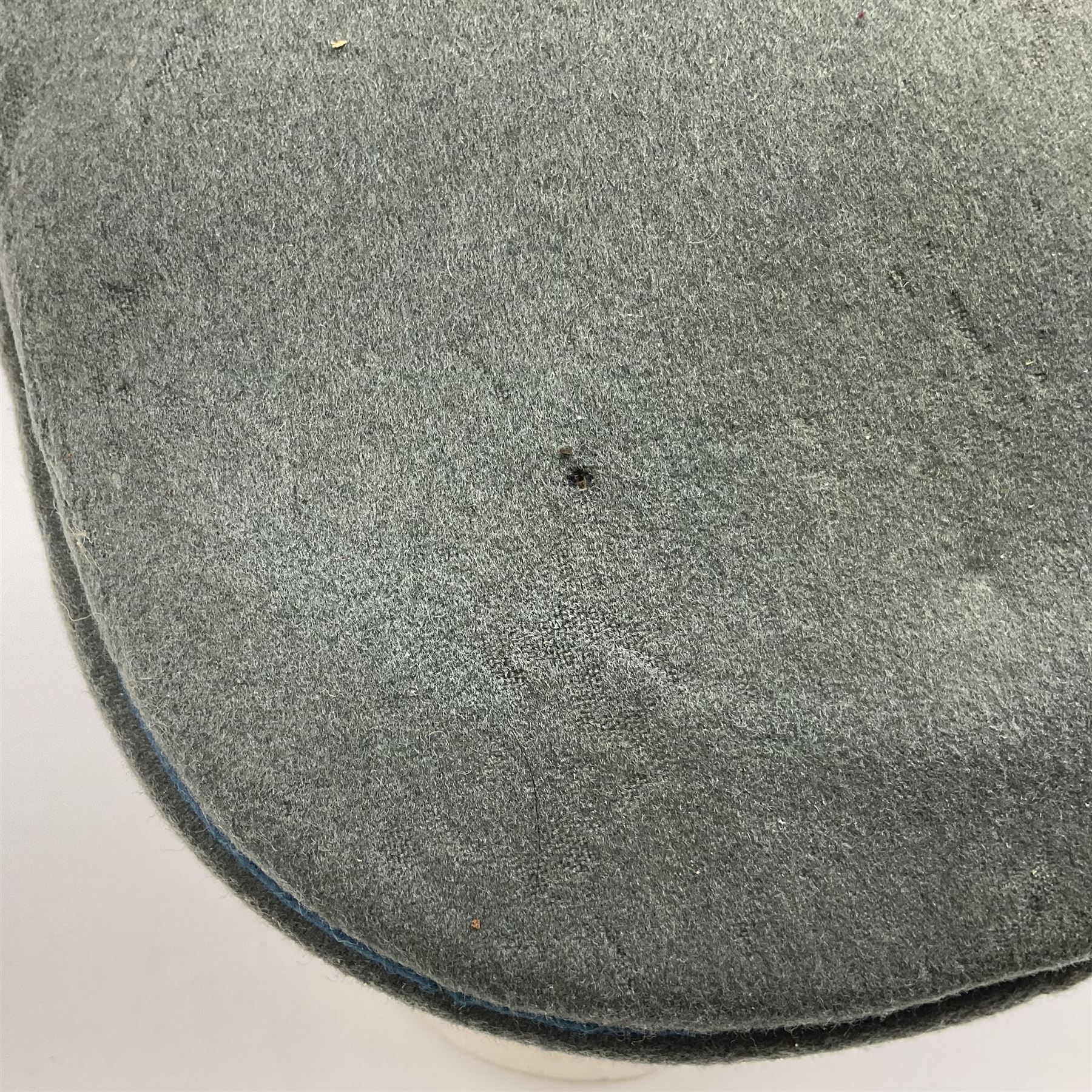 WW2 German Infantry Officer's visor cap with cloth insignia; labelled and stamped Offizier Kleiderkasse Berlin and Erel Stirnschutz