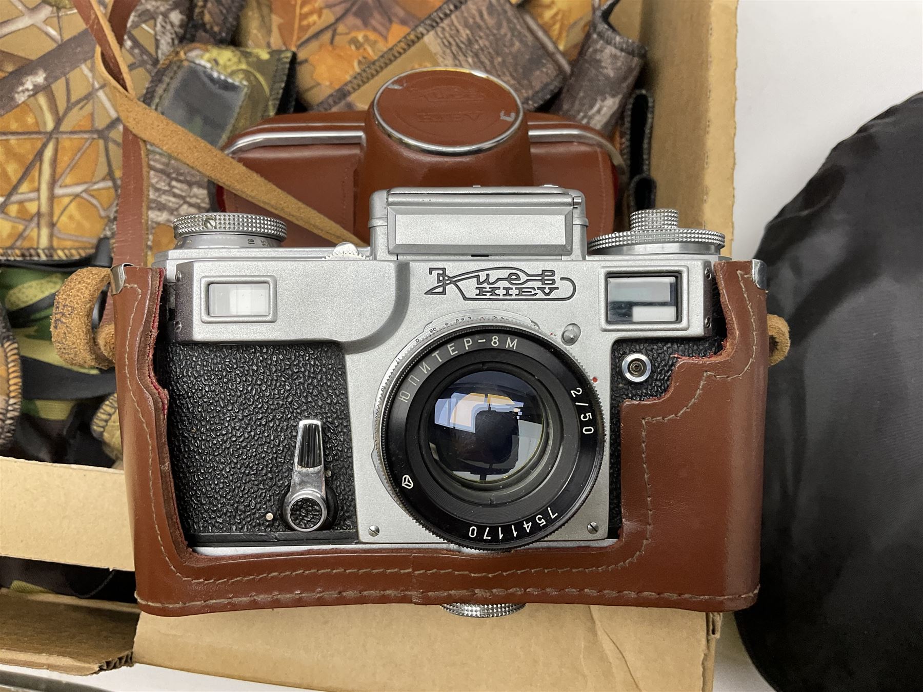 Rocwing photography studio lighting stands and shades, together with digital cameras and other camera equipment, in three boxes  