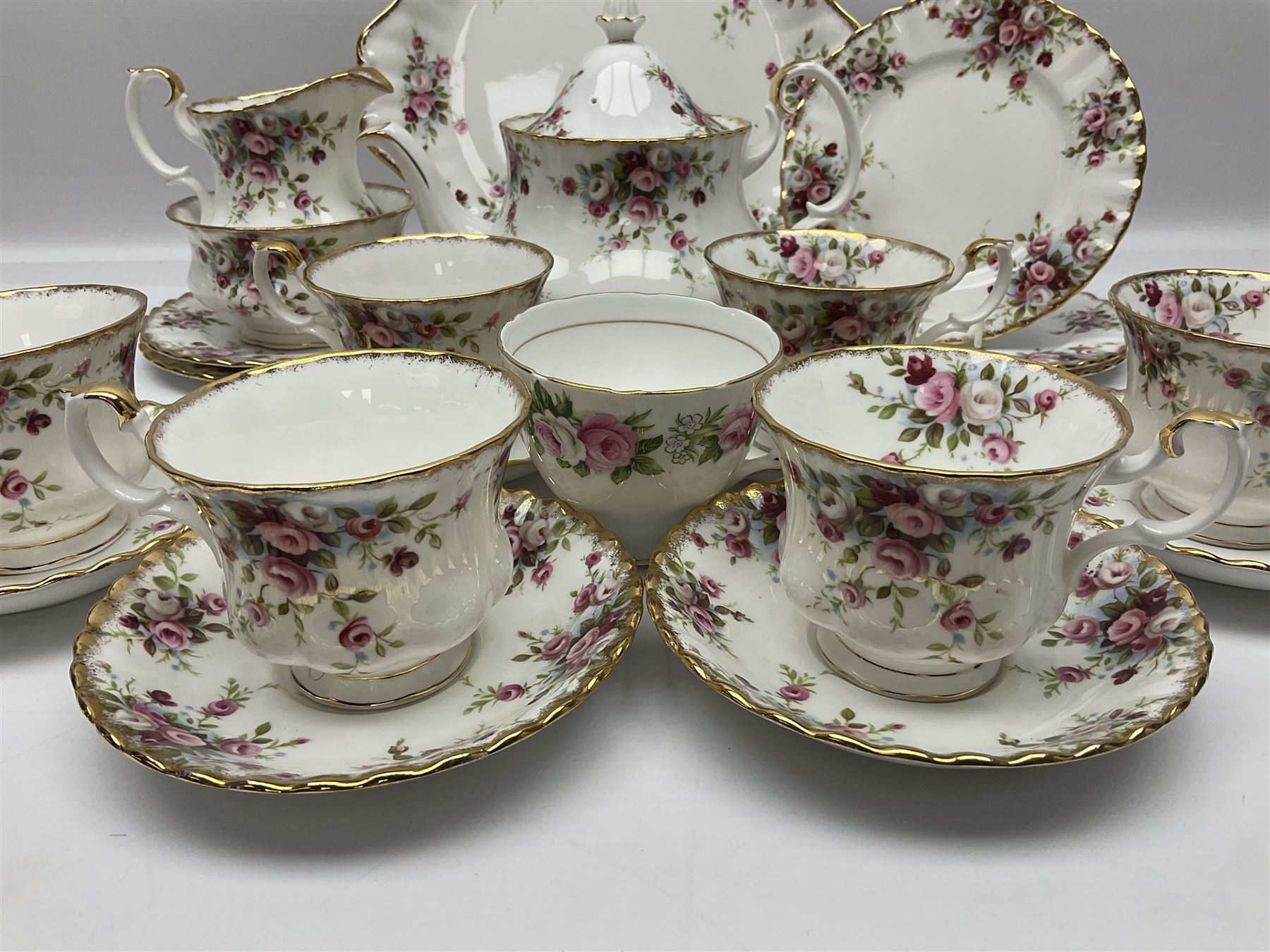 Royal Albert Cottage Garden pattern tea service for six people, comprising teapot, milk jug, sugar bowl, teacups and saucers, side plates and cake plate, all with printed mark beneath