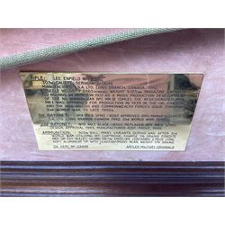 WW2 Lee Enfield No.4 Mk.1 .303 bolt-action rifle with hinged butt compartment, made by SA Ltd., Long Branch, Canada 1942, serial no.5L0646 L113cm; mounted on a framed display board with No.4 Mk.II spike bayonet, No.9 Mk.1 blade bayonet, two inert 5-round clips and brass biographical plaque by Antler Military Originals detailing DA Cert No.C3444 OLD STYLE DEACTIVATION SO FIREARMS CERTIFICATE REQUIRED OR RFD